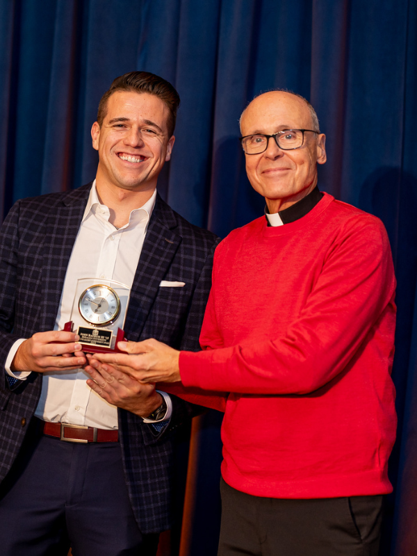 Alumni with Fr. Jim Greenfield at Alumni Awards